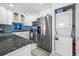 Kitchen with stainless appliances, subway tile backsplash and granite counters at 1351 Gulf Blvd # 209, Clearwater Beach, FL 33767