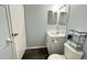 Bathroom with vanity, mirror, and toilet at 1400 Costa Mesa Dr, Wesley Chapel, FL 33543