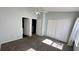 Bedroom featuring closet and open door view to the bathroom at 1400 Costa Mesa Dr, Wesley Chapel, FL 33543