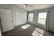 Bedroom featuring closet and natural light from the windows at 1400 Costa Mesa Dr, Wesley Chapel, FL 33543