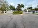 Elegant gated entrance with meticulously maintained landscaping at this secure community at 1400 Costa Mesa Dr, Wesley Chapel, FL 33543