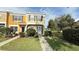 Charming two-story townhome with well-maintained landscaping and a welcoming entryway at 1400 Costa Mesa Dr, Wesley Chapel, FL 33543