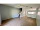 Spacious living room features tile flooring, neutral walls, and a staircase, offering a versatile living space at 1400 Costa Mesa Dr, Wesley Chapel, FL 33543
