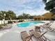 Beautiful community pool with lounge chairs offers a relaxing outdoor space at 1400 Costa Mesa Dr, Wesley Chapel, FL 33543
