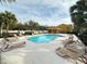 Enjoy a refreshing swim in the inviting community pool, surrounded by ample lounge seating and scenic views at 1400 Costa Mesa Dr, Wesley Chapel, FL 33543