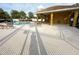 Inviting community pool area featuring ample seating and a covered pavilion for relaxation at 1400 Costa Mesa Dr, Wesley Chapel, FL 33543