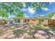 A spacious backyard with a wood fence offers privacy and a tranquil outdoor space at 1433 Spring Ln, Clearwater, FL 33755