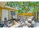 A covered patio with outdoor seating at 1433 Spring Ln, Clearwater, FL 33755