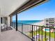 Spacious balcony with seating and stunning ocean and pool views at 1480 Gulf Blvd # 1004, Clearwater Beach, FL 33767
