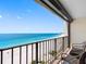 Relaxing balcony view featuring comfortable seating and panoramic ocean scenery at 1480 Gulf Blvd # 1004, Clearwater Beach, FL 33767