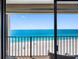 Breathtaking balcony view overlooking a pristine beach with crystal-clear turquoise waters at 1480 Gulf Blvd # 1004, Clearwater Beach, FL 33767