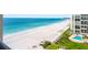 Panoramic beach view featuring soft sands, blue waters, and swaying palm trees at 1480 Gulf Blvd # 1004, Clearwater Beach, FL 33767