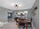 Charming dining area adjacent to the kitchen, with seating for four and modern lighting at 1480 Gulf Blvd # 1004, Clearwater Beach, FL 33767