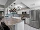 Modern kitchen with white cabinets, stainless steel appliances and granite countertops at 1480 Gulf Blvd # 1004, Clearwater Beach, FL 33767