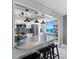 Kitchen featuring a granite countertop island, stainless steel appliances and a scenic ocean view at 1480 Gulf Blvd # 1004, Clearwater Beach, FL 33767