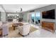 Light and bright living room with ocean views, tile floor, and comfortable seating at 1480 Gulf Blvd # 1004, Clearwater Beach, FL 33767