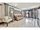 Elegant lobby featuring designer furniture, tiled floors, and paneled walls at 1480 Gulf Blvd # 1004, Clearwater Beach, FL 33767