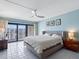 Comfortable main bedroom with access to a balcony and amazing city views at 1480 Gulf Blvd # 1004, Clearwater Beach, FL 33767