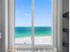 Beautiful ocean view from a window decorated with seashells in this property at 1480 Gulf Blvd # 1004, Clearwater Beach, FL 33767