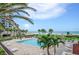 Resort style pool area with palm trees and ocean views at 1480 Gulf Blvd # 1004, Clearwater Beach, FL 33767