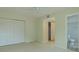 Light and airy bedroom with closet and adjacent bathroom at 1509 Cherry Hills Dr, Sun City Center, FL 33573