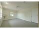 Bonus room with vinyl flooring, a ceiling fan, and a view of the yard at 1509 Cherry Hills Dr, Sun City Center, FL 33573