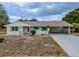 Charming single-story home featuring a long driveway and carport at 1509 Cherry Hills Dr, Sun City Center, FL 33573