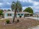 Charming single-story home featuring a long driveway and carport at 1509 Cherry Hills Dr, Sun City Center, FL 33573