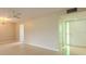 Spacious living room featuring neutral walls and a ceiling fan at 1509 Cherry Hills Dr, Sun City Center, FL 33573
