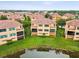 Inviting Sunset Bay home featuring a rear view of balconies and green space in this aerial shot at 1532 Citrine Trl, Tarpon Springs, FL 34689