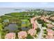 Expansive aerial view showcasing the prime lakeside location of this stylish residential community at 1532 Citrine Trl, Tarpon Springs, FL 34689