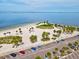 Captivating aerial view of Fred Howard Park beach with palm trees and a parking lot at 1532 Citrine Trl, Tarpon Springs, FL 34689