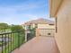 The balcony offers beautiful views of the community pond at 1532 Citrine Trl, Tarpon Springs, FL 34689