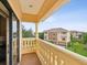 Balcony overlooking the community and lush greenery at 1532 Citrine Trl, Tarpon Springs, FL 34689