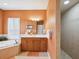 The primary bathroom features dual vanities, separate tub, and step-in shower at 1532 Citrine Trl, Tarpon Springs, FL 34689
