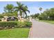 Sunset Bay Townhomes, a gated community with beautiful entryways and tropical landscaping at 1532 Citrine Trl, Tarpon Springs, FL 34689