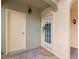 Charming entryway showcasing a decorative wreath on the front door and attractive brick pavers at 1532 Citrine Trl, Tarpon Springs, FL 34689