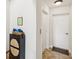 Hallway entrance with tile floors, storage cabinet, and a door with an elevator adjacent to it at 1532 Citrine Trl, Tarpon Springs, FL 34689