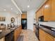 Spacious kitchen features granite countertops, a breakfast bar, and a full suite of appliances at 1532 Citrine Trl, Tarpon Springs, FL 34689