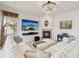 Bright living room features a fireplace, a TV, and comfortable seating, creating an inviting atmosphere at 1532 Citrine Trl, Tarpon Springs, FL 34689