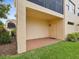 Outdoor patio offering covered space and views of the surrounding lawn and landscaping at 1532 Citrine Trl, Tarpon Springs, FL 34689