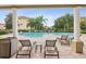 Inviting community pool and hot tub with plenty of lounge chairs, perfect for relaxation at 1532 Citrine Trl, Tarpon Springs, FL 34689