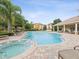 Enjoy this community pool and hot tub that offers a relaxing outdoor space for residents at 1532 Citrine Trl, Tarpon Springs, FL 34689