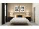 Cozy bedroom featuring a comfortable bed, stylish nightstands, and chic modern decor at 16963 Warm Hand Ct, Land O Lakes, FL 34638