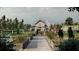 Rendering of the community garden with raised planting beds, white barn and pergola at 16963 Warm Hand Ct, Land O Lakes, FL 34638