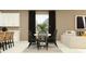 Charming dining area with modern decor, a stylish table, and a view to a relaxing living space at 16963 Warm Hand Ct, Land O Lakes, FL 34638