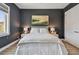 Lovely bedroom features an elegant gray headboard and a bright window at 18 Franklin S Ct # D, St Petersburg, FL 33711