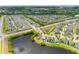 Expansive aerial view of a residential community with serene lakes and well-maintained streets and landscaping at 1811 Redmond Brook Ln, Ruskin, FL 33570