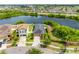 Stunning aerial shot of a waterfront home with a spacious yard, nestled in a picturesque community near a lake at 1811 Redmond Brook Ln, Ruskin, FL 33570
