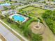 Community amenities featuring pool, playground, green spaces, and sidewalks in a well-maintained neighborhood at 1811 Redmond Brook Ln, Ruskin, FL 33570